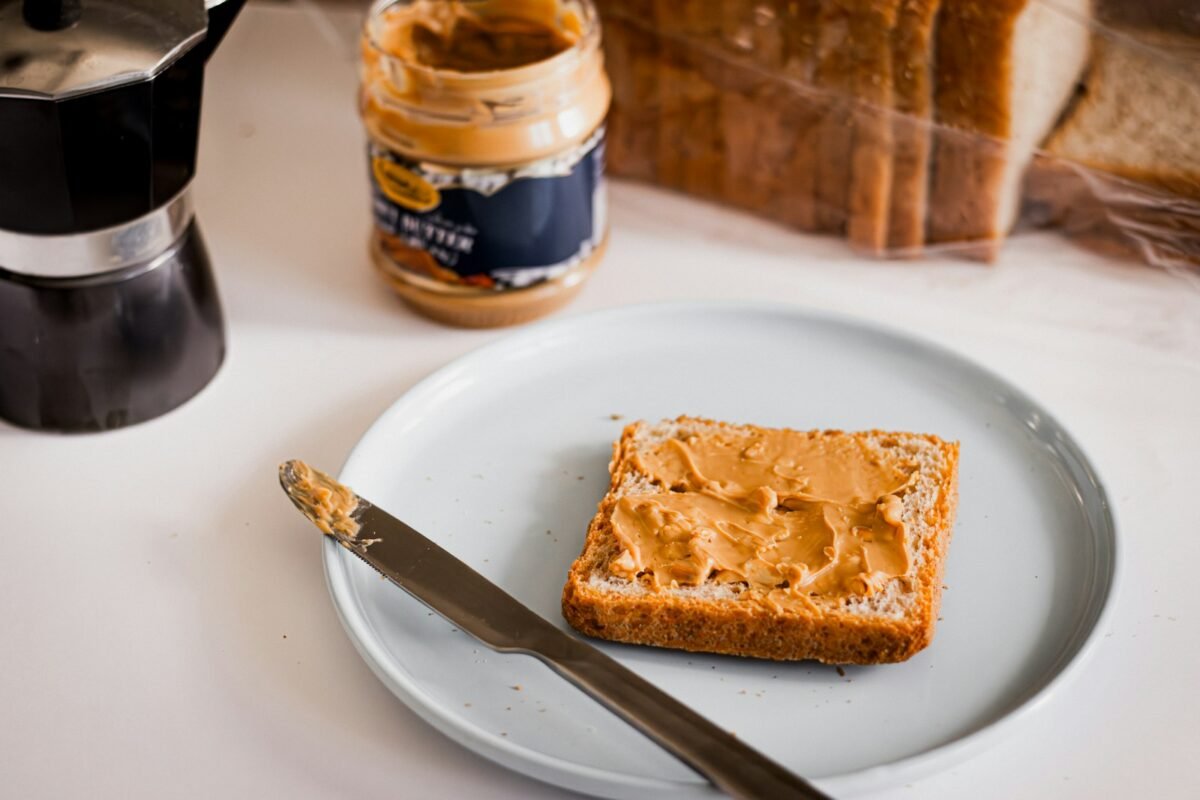 a piece of bread sitting on top of a white plate